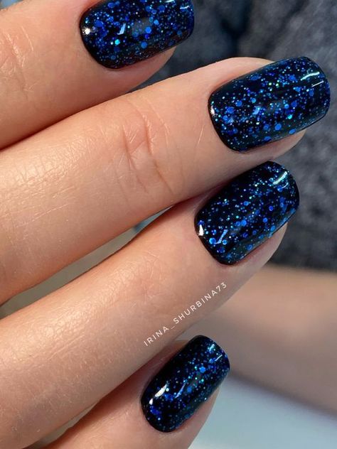 19 Gorgeous Winter Acrylic Nail Colors for 2023-2024 - thepinkgoose.com Pretty Nail Ideas Acrylic Simple, Gel Nails For January, Glitter Gel Acrylic Nails, Black Nails Blue Glitter, Blue Dip Nails With Glitter, Black And Blue Glitter Nails, Gel Polish Manicure Short Nails, Blue Dipped Nails Ideas, Sparkly Nails Blue