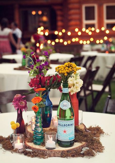 Mixed vessel | mismatched bottles + candles of wooden slice wedding centerpieces #weddingcenterpieces #centerpieces #rusticwedding #summerwedding Flowers In Vases, Eclectic Wedding, Rustic Wedding Centerpieces, בר מצווה, Wildflower Wedding, Whimsical Wedding, Utah Weddings, Different Flowers, Vineyard Wedding