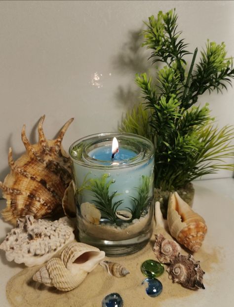 Ocean Theme The gel wax was decorated with sand, shells, glass pebbles and artificial foliage. Soy wax candle was scented with Fresh Linen fragrance oil. Sea Candle Ideas, Candle In Shell, Beachy Candle, Ocean Gel Candle, Sea Shells Candles, Artificial Foliage, Fresh Linen, Ocean Themes, Handmade Candles