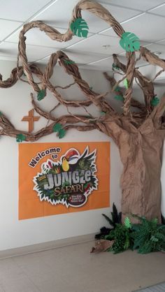 church jungle themed missions displays | Our VBS Jungle Tree for advertisement at church. Jungle Tree Decoration, Jungle Hallway Decorations, Jungle Hallway, Haunted Basement, Safari Vbs, Vbs Jungle, Jungle Vines, Weird Animals Vbs, Jungle Safari Theme