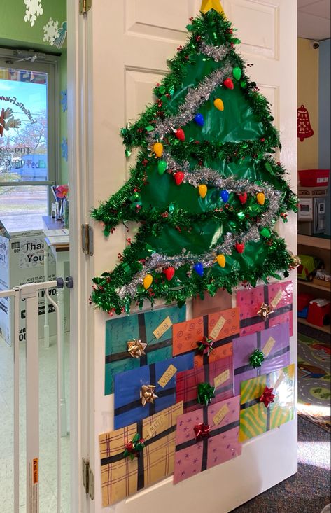 A lil Christmas tree with gifts to make your holiday door look good. Rocking Around The Christmas Tree Door, Christmas Tree Door Ideas, Christmas Tree Door Decorations, Office Xmas Decorations, Christmas Tree Door, Christmas Preschool, Tree Door, Pine Doors, Door Decorations Classroom