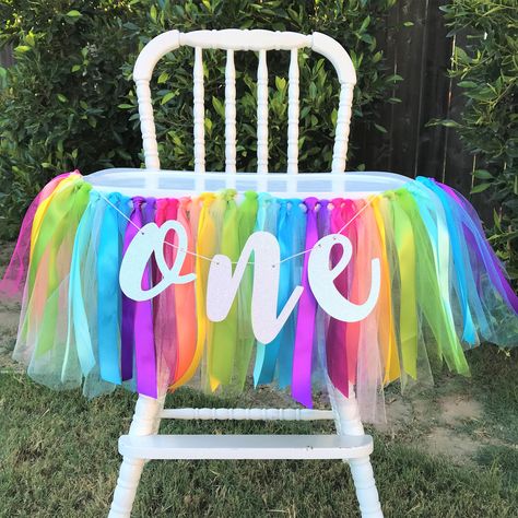 "This rainbow design ONE first birthday high chair banner is sure to be a hit with your guests. It is so incredibly beautiful and brightly colored with its satin ribbons and tulle accents. It includes shades of pink, coral, yellow, green, turquoise, aqua and purple in both tulle and ribbon cuts.  The Ribbon Garland is approximately 2.5 ft wide and hangs about 9\" long. It is made of gorgeous satin ribbons and tulle. It is strung on a piece of white twine which allows extra on each end for hangin Rainbow High Chair Banner, Trolls Smash Cake, Trolls First Birthday, Diy Trolls Birthday Party, Birthday Photo Backdrop, Trolls Cake, Rainbow First Birthday, Trolls Party, First Birthday Banner