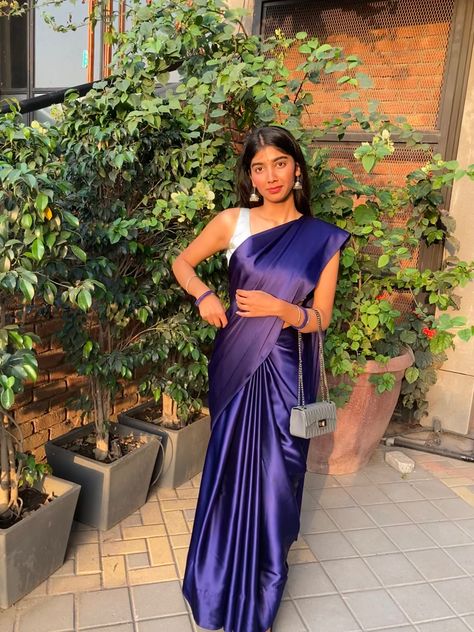 Royal blue satin saree with silver blouse Satin Blue Saree, Navy Blue Saree With Silver Blouse, Satin Saree Aesthetic, Blue Saree Black Blouse, Blue Satin Saree Look, Blue Farewell Saree, Plain Satin Saree With Designer Blouse, Satin Saree For Farewell, Royal Blue Saree Contrast Blouse