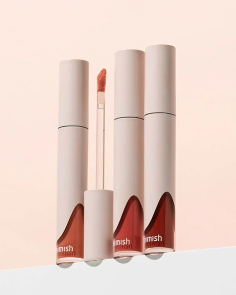 Hydrating Matte Lipstick Heimish’s Dailism Liquid Lipstick comes in three universally flattering shades for a pop of color on your lips. It hydrates and leaves a matte, yet subtly glossy finish. Price reduced! Open by 9/14/2025. Use within 12 months after opening. Great for Skin Types: All Skin TypesSkin Concerns: All, Dryness Why We Love it Heimish’s Dailism Liquid Lipstick provides long-lasting lip color. Its soft-matte, cream-type liquid comes in three shades that are all layerable and non-dr Liquid Lipstick Product Photography, Liquid Lipstick Packaging, Lipstick Packaging Design, Foundation Packaging, Lipstick Photography, Lipstick Packaging, Lipstick Design, Burning Rose, Gel Moisturizer