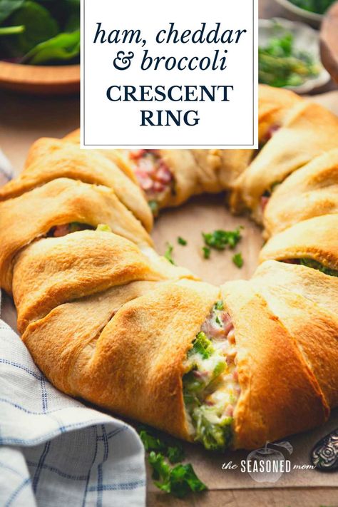 Ham and cheese crescent rolls bake in a ring for an easy-to-serve, easy-to-slice weeknight dinner or crowd-pleasing appetizer. The ham, cheddar, and broccoli crescent ring is flaky, golden brown, and stuffed with a creamy, cheesy, and flavorful filling. It's delicious alongside a simple salad, potato chips, or fresh fruit. Crescent Roll Ring Recipes, Ham And Cheese Crescent Rolls, Ham And Cheese Crescent, Crescent Ring Recipes, Crescent Roll Bake, Salad Potato, Cheese Crescent Rolls, Crescent Recipes, Crescent Ring