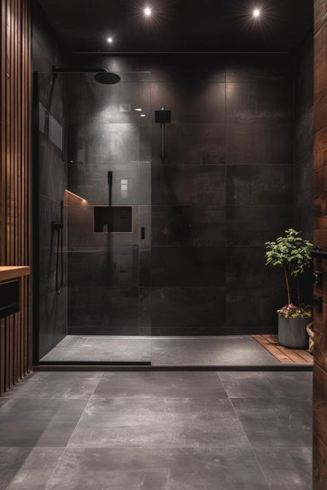 A chic black tile shower idea showcasing modern designs and stylish finishing touches, perfect for bathroom makeovers. Dark Vibe Bathroom, Black Marble Tile Shower Ideas, Small Bathroom Ideas Black Floor, All Tile Bathroom Ideas, Floor To Ceiling Tiled Bathrooms, Dark Shower Tile Ideas Master Bathrooms, Black Wet Room, Black Tile Shower Wall, Black Bathroom Shower Tile