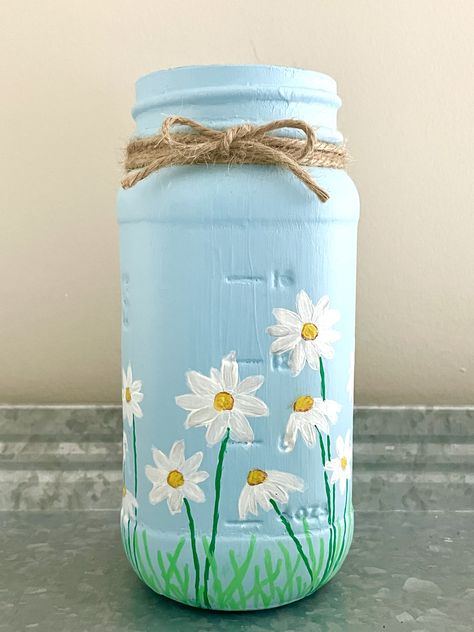 Unlock your creativity with our step-by-step tutorial on painting mason jars. Learn the secrets to stunning designs and personalized decor. Perfect for #DIYlovers, #craftingenthusiasts, and #homedecorinspiration. Start your #masonjarproject today and bring your artistic vision to life! #paintingtips #homedecorideas #DIYcrafts Painting On Glass Jars Ideas, Jar Paint Ideas, Painting On Bottles Ideas, Painting On Jars, Jar Painting Ideas Cute Easy, Painting On Jar, Jar Painting Ideas Cute, Diy Vase Painting, Mason Jar Painting Ideas