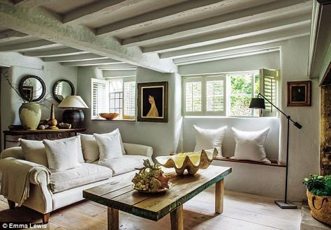 In the living room, shades of white and grey are layered with weathered wood in varying to... Cotswold Cottage Interior, Belgian Interiors, Emma Lewis, Futurist Architecture, Decorating Hacks, Minimalist Dekor, Interior Simple, White Beams, Swedish Decor