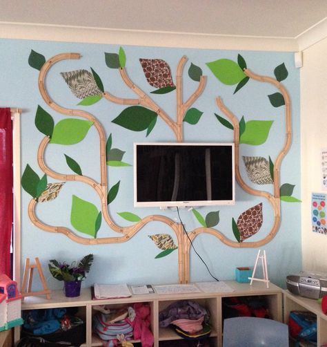 I got the idea from a friend to use wooden train tracks to create a family tree in my room. I used coloured paper for the leaves and added the family photos to them. I've had great feedback from families and coworkers! I think it turned out great! Family Tree Childcare, Classroom Family Tree, Create A Family Tree, Classroom Tree, Childcare Rooms, Daycare Rooms, Wooden Train Track, Display Family Photos, Preschool Circle Time