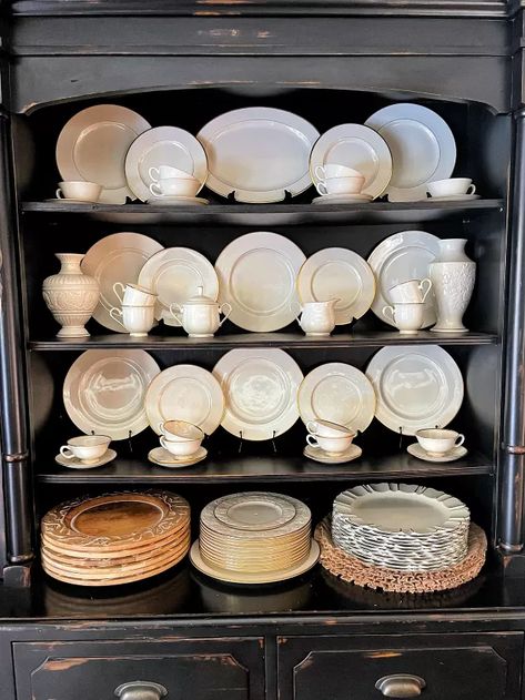 Looking for ways to arrange a china cabinet and hutch? Wait until you see how to decorate shelves with an uncluttered cozy look. I get it. Styling a china cabinet and hutch is not easy and a little intimidating. To be forthright, I struggled with this cabinet for years. I had a red spode collection that wasn’t very large and couldn’t figure out how to make it look right so it was visually appealing. Eventually, I came up with THIS design and loved it for a while. But I lo… Display China In Cabinet, How To Arrange A China Cabinet, How To Display China In Cabinet, Styling A China Cabinet, Decorate Dining Room, China Cabinet Decor, Cabinet Styling, China Hutch Decor, Decorate Shelves