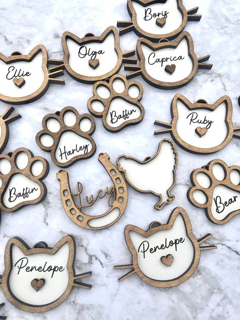 Remember beloved pets with these custom holiday ornaments featuring personalized details.#personalizedgifts #woodengifts #festivegifts #handmadegifts #lasercutdesigns #christmasgiftideas #christmasornaments Pet Ornaments, Custom Pet Tags, Pet Memorial Jewelry, Pet Projects, Laser Engraved Ideas, Cricut Project Ideas, Pet Name, Wood Crafts Diy, Animal Projects