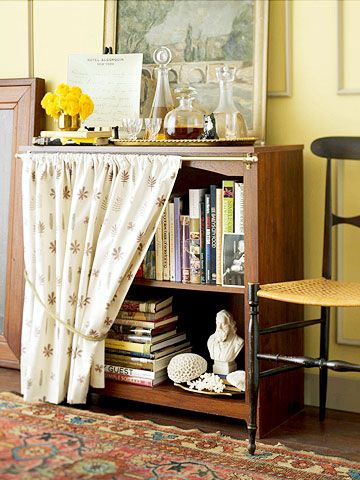 Skirted Book Storage:   A ready-to-assemble bookcase becomes an attractive focal point when draped with a cafe curtain. Attach a lightweight curtain rod to the top of the bookcase; add the fabric you fancy. Decorating With Books, Diy Food Storage, Food Storage Shelves, Decorating Books, Shelf Cover, Books Ideas, Book Storage, Book Shelf, Sewing Room