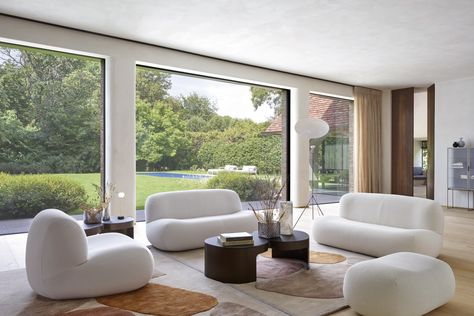 Puffy, plump designs have been everywhere of late. See the best trends to incorporate into your interiors today. Yabu Pushelberg, Ligne Roset, Cozy Fireplace, Fabric Armchairs, Low Tables, Home Trends, A Living Room, Settee, Design Milk