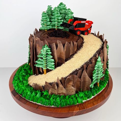 Skid Steer / Tree Stump Cake! Chocolate cake layers with Nutella buttercream encased in a chocolate buttercream. Decorated with chocolate bark and a candy melt trees. Tree Cakes Birthday, Skid Steer Birthday Cake, Buttercream Trees On Cake, Skid Steer Birthday Party, Skid Steer Cake, Atv Cake, Moto Cake, Hiking Cake, Jeep Cake