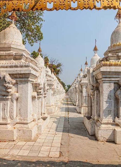 Kuthodaw Pagoda is a Buddhist stupa, located in Mandalay, Burma, that contains the world's largest book. It lies at the foot of Mandalay Hill and was built during the reign of King Mindon. Mandalay Hill, Buddhist Stupa, Mandalay, Big Book, Worlds Largest, Reign, Eiffel Tower, Building