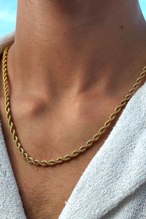 Picture showcasing a gold necklace for men in a twisted rope 2mm design. It's an exceptional piece of jewelry that catches the eye with its rich gold accent and unique structure. Specially designed for the modern man, it impeccably complements streetwear fashion, emanating an urban vibe that's impossible to ignore. Reflecting skillful craftsmanship, this necklace embodies the perfect fusion of traditional aesthetics and contemporary style. Men Gold Accessories, Gold Accessories For Men, Men’s Gold Necklace, Debs Suits, Necklace Design For Men, Chains For Men Gold, Mens Gold Necklace, Men Gold Chain, Gold Necklace Men