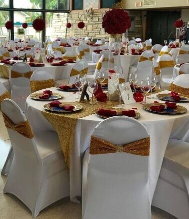 Red Cream And Gold Party Decor, Red Gold And Ivory Wedding Decor, White Chair Covers With Gold Sash, Red White And Gold Table Setting, White And Red Party Decorations, Red And Gold Wedding Table Decor, Red Gold White Wedding Theme, Red And White Reception, Red And Gold Table Decorations