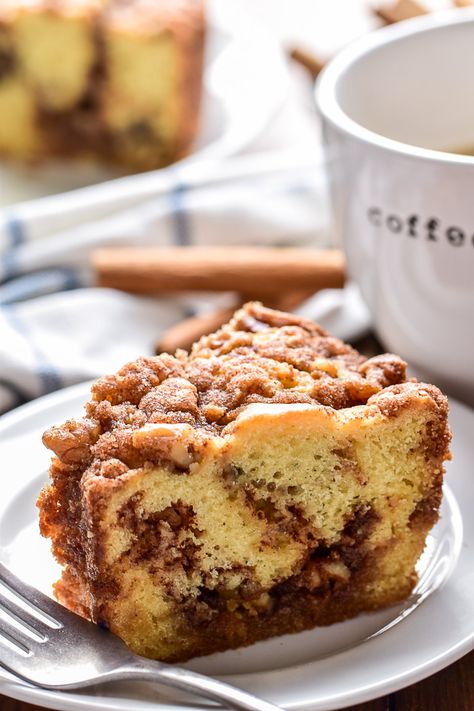 Grandma's Coffee Cake recipe... aka the BEST coffee cake ever! This recipe is thick, buttery, and layered with the most delicious cinnamon swirl. The perfect addition to your weekend or holiday brunch! Best Coffee Cake Loaf, Cinnamon Coffee Cake Bread, Cinnamon Swirl Coffee Cake Loaf, Sour Cream Walnut Coffee Cake, Magnolia Coffee Cake, Coffee Cinnamon Cake, Coffee Cake For A Crowd Brunch, Sourdough Coffee Cake Recipes, Cinnamon Walnut Coffee Cake Recipe