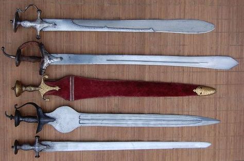 Various Indian swords. #1. Khanda with silver plated tulwar hilt, wootz blade. #2. Sikh pattisa sword with silver plated khanda hilt. #3. Pahari sword ( cobra sword) with an very good old khanda hilt. #4. Pahari sword (cobra sword) gold koftgari at the blade and the hilt, with the original steath. #5. Indian straight sword with an Rajasthan tulwar hilt. Historical Swords, Types Of Swords, Cyberpunk