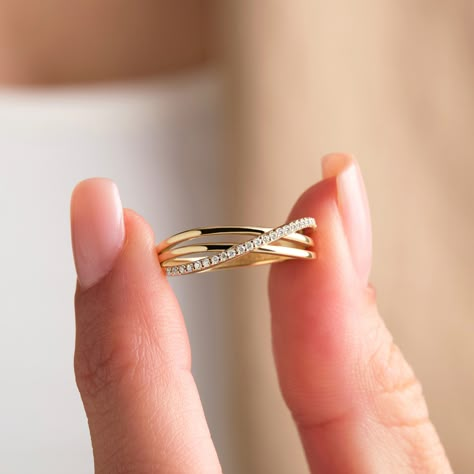 The 14K Gold Crossover Triple Ring is a stunning piece of handmade jewelry featuring pavé diamonds on interlocking bands. This rolling ring design with triple rings creates a beautiful and unique look, perfect for any occasion. The gold triple stacking ring with pavé diamonds is a lovely design that is both dainty and cute, making it a great choice for those who love minimalist rings. This dainty cross ring is crafted from high-quality solid gold. The thin band and criss-cross ring style make it perfect for wearing alone or stacking with other rings. This wrap ring, also referred to as a triple cross ring or wraparound ring, is stunning and refined, with a dainty yet eye-catching sparkle. This crossover ring is a great gift option for any special woman in your life. It can be given as a th Sleek Ring Designs, Everyday Diamond Rings, Unique Engagement Rings For Women, Everyday Gold Rings, Simple Diamond Rings Everyday, Everyday Rings Gold, Simple Gold Rings Everyday, Everyday Diamond Ring, Simple Ring Design