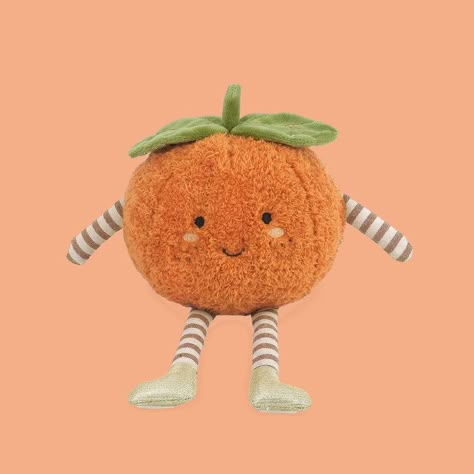 A darling little clementine orange shaped stuffed animal with a smiley face and little black eyes sits on an orange background.  the Clementine has leave on top of it's head and striped legs and arms with little gold shoes. Sweets Gift, Notes Gift, Book Candle, Book Stationery, 50th Gifts, Art Furniture, Plush Toy, Animal Art, Hello Kitty