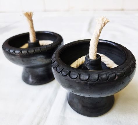 1 pair of Pottery Oil Lamp, Black clay lamp Handmade Terracotta round Décor Home Produced by a group of villagers from Koh Kret, Nonthaburi, famous for making traditional Thai pottery. uniqueness and unique beauty the only place in Thailand. Color – Black Material – Clay Quantity – 1 pair Size – 3.5”(width) x 3”(height) ## Made in Thailand ## Clay Oil Lamp, Ceramic Oil Lamp, Thai Pottery, Clay Lamps, Clay Lamp, Ancient Oil Lamp, Thai Decor, Lamp Handmade, Temple Art