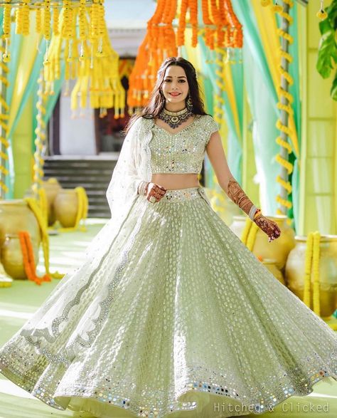 The Bridal Affair India® on Instagram: “It’s a happy Sunday when you spot the happiest twirl! Via @ritikahairstylist Make Up: @dollyouup_bys Flowers : @floristaa Outfit :…” Colourful Lehenga, Gorgeous Lehenga, Bride Lehenga, Silk Half Saree, Orange Lehenga, Mirror Work Lehenga, Bridal Lehenga Designs, Cotton Lehenga, Mirror Work Blouse