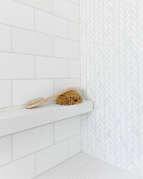 A floating white Caesarstone mini shelf is the perfect shaving ledge and place to stash showering essentials. The thassos and mother-of-… Bathroom Niche Design, Tile Shower Shelf, Mini Shelf, The Weather Outside Is Frightful, Weather Outside Is Frightful, Bathtub Tile, Bathroom Shower Design, Shower Storage, Master Shower