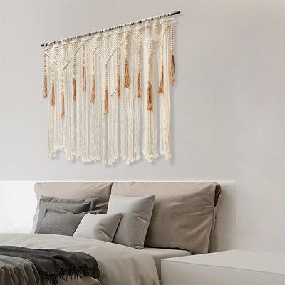 The macrame wall hanging is a tasteful and warm home decor item. It is made of high-quality material and a fine weaving process, showing unparalleled exquisite craftsmanship. Bohemian-style products will bring a more unique atmosphere to your room, making your room more cozy. Finish: White/Orange | Dakota Fields Macrame Wall Decor Fabric in Orange | Wayfair | Home Decor Macrame Wall Hanging Decor, Tapestry Curtains, Doorway Decor, Fabric Wall Decor, Warm Home Decor, Macrame Wall Decor, Warm Home, Handmade Wall Hanging, Large Macrame Wall Hanging