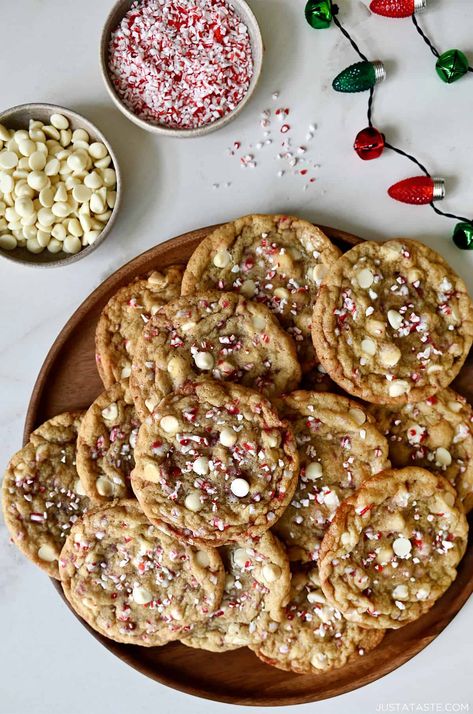 Indulge in the magic of the season with Soft White Chocolate Peppermint Cookies! A perfect blend of rich white chocolate, cool peppermint and a chewy texture that's pure bliss. Ideal for holiday gatherings or Christmas cookie platters! White Chocolate Dipped Peppermint Cookie, Peppermint White Chocolate Chip Cookies, Peppermint White Chocolate Cookies, White Chocolate Candy Cane Cookies, White Chocolate Christmas Cookies, Christmas Peppermint Cookies, Holiday Chocolate Chip Cookies, Chocolate Chip Peppermint Cookies, Peppermint Cookies Recipe