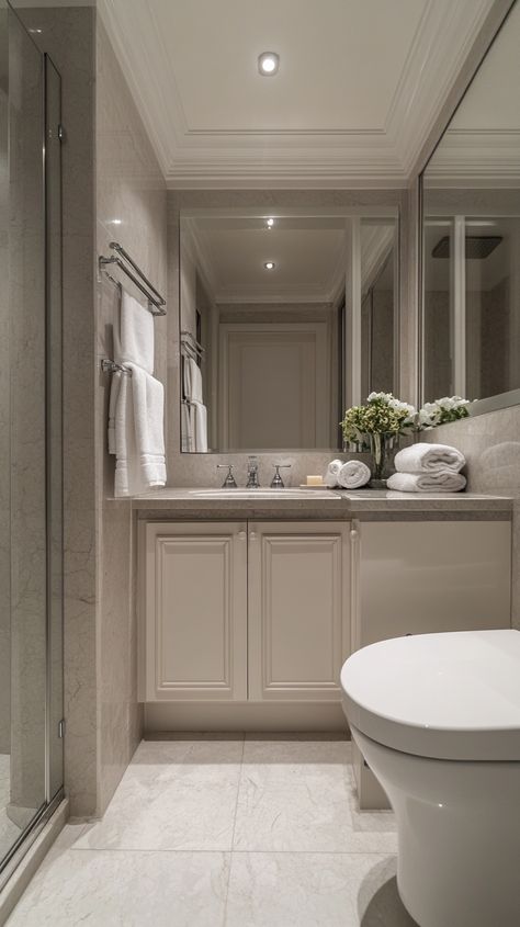 Elegant small bathroom featuring a corner vanity, grey marble countertop, and warm decor, bathed in natural light. Grey Beige Bathroom, Half Bathroom Decor Ideas, Half Bathroom Decor, Earthy Living Room, Corner Vanity, Symmetrical Design, Couch Decor, Chic Spaces, Warm Colour Palette