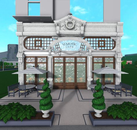 Restaurant Bloxburg Exterior, Realistic Bloxburg Cafe Exterior, Bloxburg Art Gallery, Bloxburg Town Places Ideas, French Cafe Bloxburg, Bloxburg Cafe With Apartment, Bloxburg Fancy Restaurant Ideas, Bloxburg Store Exterior, Bloxburg Cafe And Apartment