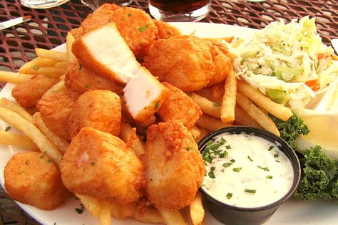 Fried scallops from Pearl, a harborside restaurant in Wellfleet, MA with outstanding views of Cape Cod from its deck. Hidden Restaurants, Fried Scallops, Batman Who Laughs, Girls Cap, Sea Scallops, Scallop Recipes, Cap Sleeve Shirt, Fried Food, Seafood Restaurant