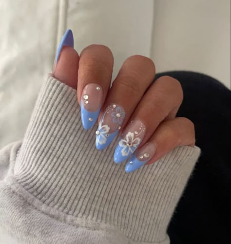 There's a new beauty trend taking over Instagram and it's absolutely stunning. Say hello to "quartz nails". Blue Floral Nails Acrylic, Blue Nails Hibiscus, Blue Almond Nails With Flowers, Hibiscus Flower Nail Designs, Baby Blue Hibiscus Nails, Nail Designs Pink And Green, Baby Blue Flower Nails, Summer Nail 2024 Trends Blue, Cute Flower Nails Acrylic