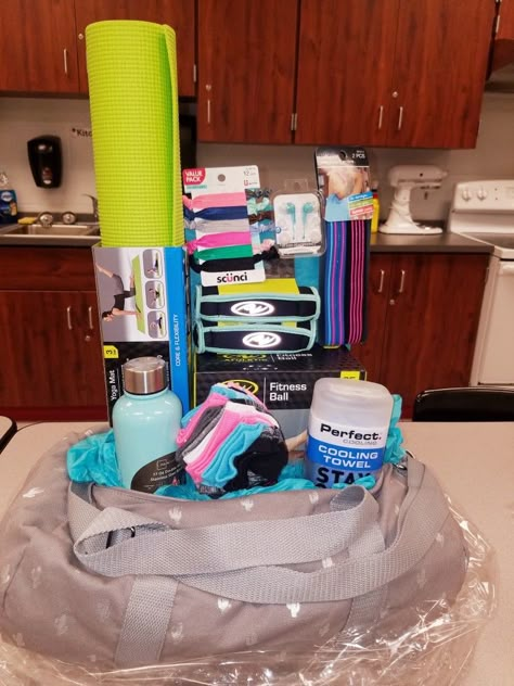 Fitness raffle or gift basket Raffle Prizes For Adults, Women Raffle Basket Ideas, Gym Gift Basket, Runner Gift Basket, Duffel Bag Gift Basket, Track Gift Basket, Gym Basket Gift Ideas, Yoga Basket Ideas, Athlete Gift Basket