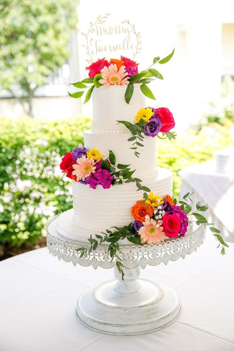 Mexican Wedding Cake Topper, Wedding Cakes With Bright Flowers, White Cake With Colorful Flowers, Bright Flower Wedding Cake, Bright Wedding Cakes, White Wedding Cake With Colorful Flowers, August Wedding Cake, Wedding Cake With Colorful Flowers, Mexican Cake Ideas