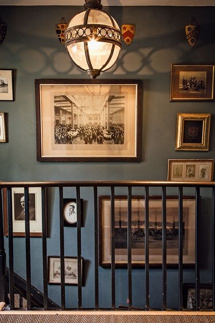 Dark Blue Hallway, Hallway Picture Display, Base For Art, Hanging Pictures On The Wall, Dark Staircase, Staircase Pictures, Art Layout, Blue Hallway, Hallway Pictures