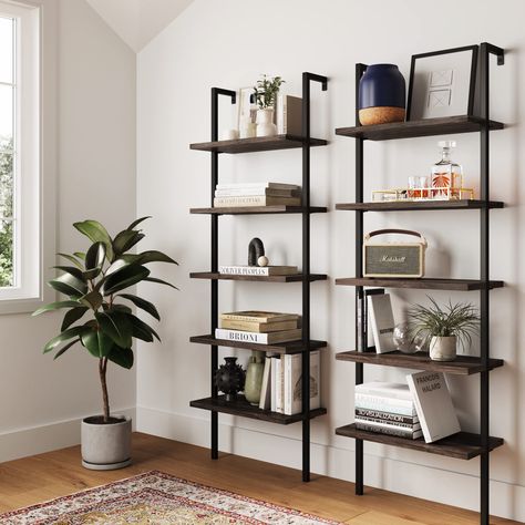 PRICES MAY VARY. The Theo Industrial Ladder Shelf is built with a durable metal frame and oak-laminate reclaimed wood for a vintage look. This 5-tier bookcase has a minimalist style that can fit your home office or living room. Stable bookshelves can carry 50 lbs. per shelf. Put multiple bookcases together to create a multifunctional space that fits your need. 25-minute assembly and lifetime manufacturer warranty: try for 100 days. Wood And Metal Shelves Living Room, Modern Industrial Book Shelf, Black Wood Shelves Living Room, Metal Office Shelves, Ladder Tv Unit, Concrete Shelves Living Room, Metal Book Shelves In Living Room, Charcoal Book Shelves, B&m Shelves