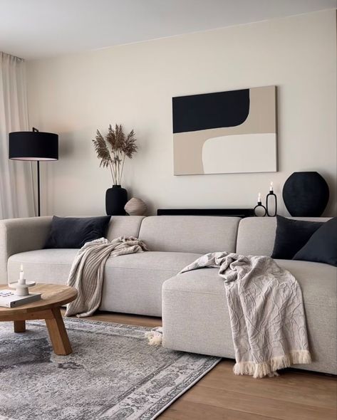 living room wall decor ideas Minimal Black And White Living Room, Grey Beige Black And White Living Room, Beige L Couch Living Room Ideas, Beige Couch Apartment, Cream And Black Lounge, Black And Beige Room Aesthetic, Lime Wash Tv Wall, Neutral And Black Home Decor, Black Grey Beige Living Room