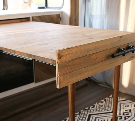 We’re obsessed with this space-saving DIY expandable table that's hidden when not in use, but transforms into a desk or table in under a minute! #rvrenovation #rvreno #expandingtable #diydesk #transformingtable #tabledesign #modularfurniture #rvinspiration #campermakeover #hiddentable #drawertable #tinyhomeideas Murphy Style Dining Table, Slide Out Dining Table, Slide Out Table Camper, Hidden Folding Table, Tiny House Table Ideas, Dropleaf Tables Diy, Pull Out Table From Cabinet, Murphy Table Diy Small Spaces, Hidden Table In Cabinet