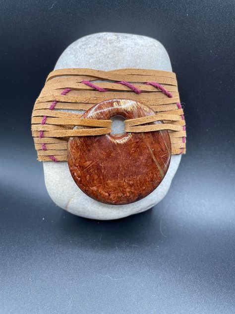 "Large whole quartz rock wrapped w leather and hemp using basket weaving techniques.  Medalion added to top this unique look.   Stone is 4\"x3\"x1.5\" in size." Wrapping Rocks With Hemp, Wrapping Rocks, Rock Wrapping, Wrapped Rocks, Quartz Rock, Rope Crafts Diy, Hematite Necklace, Like A Rock, Japanese Rock