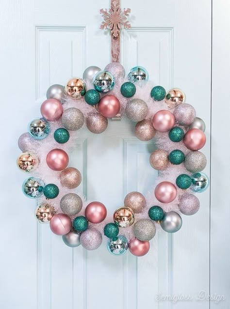 Learn how to make your own DIY retro Christmas wreath. It features tinsel and ornaments and is so easy to make. It's the perfect wreath for your front door! Diy Bauble Wreath, Christmas Bauble Wreath, Christmas Wreaths For Front Door How To Make, Bulb Wreath Diy, Christmas Reefs For Doors, Christmas Door Wreaths Diy, Diy Wreaths For Front Door Christmas, Diy Christmas Wreaths For Front Door, Christmas Wreath Ideas Front Doors