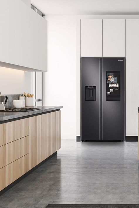 A 2-door, black Samsung Family Hub Refrigerator balances a white kitchen with natural wood cabinets and dark countertops. Black Fridge Kitchen, Fridge In Kitchen, Family Hub Refrigerator, Black Fridge, Black Fridges, Black Refrigerator, Stylish Kitchen Design, Kitchen Cabinetry Design, Tiny Kitchen Design