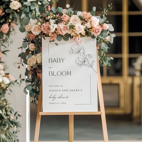 Elevate your baby shower decor with our Baby in Bloom Welcome Baby Shower sign. This sign is perfect for setting up at the entrance of the shower reception area. Choose from the following: ❃ Materials: Foam Core Board, Canvas or Poster Paper (will come rolled up) ❃ Sizes: 8x10", 11x14", 12X16", 16x20", 18x24", 24x36'' Please note:  ❃ Easel/Stand/Frame not included ❃ Background colors shown may vary slightly based on computer settings. ❃ We cannot ship to PO Boxes. Please provide a valid street address for shipping. How to order: Select "Add Personalization" and enter the name(s) and date for the sign. SHIPPING NOTES: It is highly recommended to place your order at least three weeks prior to your event (one month is ideal). There are some things that are out of my control, such as damage in Baby Shower Board Signs, Baby In Bloom Welcome Sign, Baby In Bloom Decorations, Baby Shower Welcome Table, Baby In Bloom Sign, Baby In Bloom Shower Ideas, Tea Bag Cookies, Welcome Baby Shower Sign, Welcome Sign Minimalist