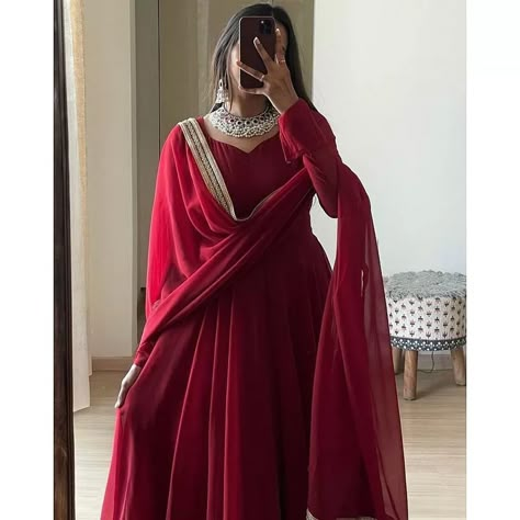 Crafted from premium Georgette fabric, this attire ensures durability and versatility in different climates. Ideal for formal occasions, evening gatherings, and celebrations, it bestows an elegant charm upon the wearer, making them stand out effortlessly. 👗✨ Classic Anarkali Suits, Maroon Anarkali With Dupatta, Red Anarkali Kurti, Red Long Anarkali Dress, Red Party Wear Dress, Anarkali Georgette Dresses, Stylish Anarkali Suits, Trending Anarkali Suits, Red Kurti Designs Party Wear