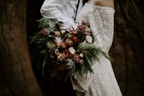 Loved working on this bridal bouquet for K+D's redwood forest wedding, complete with mushrooms, cedar, lisianthus, mums, and chocolate cosmos. Expertly captured by Quinn Oberlander! Forest Bride Bouquet, Mushroom Bridal Bouquet, Fairy Bridal Bouquet, Mushroom Wedding Bouquet, Dark Autumn Wedding, Forest Wedding Flowers, Forest Wedding Bouquet, Mushroom Bouquet, Fairytale Mushroom