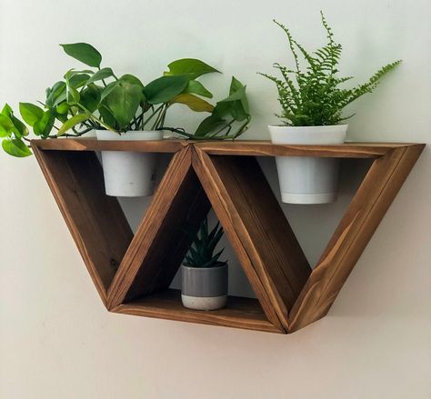 "Beautiful and unique triangle wood shelves. These are available with a 4in hole to hold plants or a jar with flowers or without the hole to use a small decorative shelf or accent piece. These unique shelves look great when hung together or separately and fit perfectly into any room to hold your favorite small trinkets and treasures! Made of pine. Each piece is hand crafted and stained. Please keep in mind every piece of wood has a one of a kind character and may vary from the exact picture show Triangle Shelf Decor, Wood Decoration Ideas, Small Scrap Wood Projects Diy, Simple Woodworking Ideas, Triangle Wood Shelf, Small Wood Projects For Beginners, Diy Projects Wood, Jar With Flowers, Wall Plant Holder