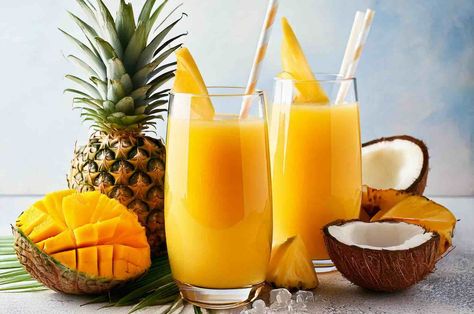 A refreshing tropical smoothie with mango, pineapple, orange juice, and coconut milk. Packed with vitamins and natural energy! Sunrise Smoothie, Fruit Smoothie Recipe, Tropical Fruit Smoothie, Mango Pineapple Smoothie, Refreshing Breakfast, Mango Pineapple, Mango Chunks, Tropical Smoothie, Smoothies For Kids