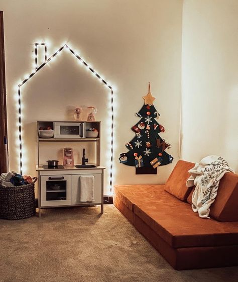 Fireplace Playroom Ideas, Sibling Playroom, Bedroom And Playroom, Playroom Twinkle Lights, Christmas Playroom Ideas, Christmas Decor Playroom, Playroom Rental House, Playroom Christmas Tree Kids, Playroom Lighting