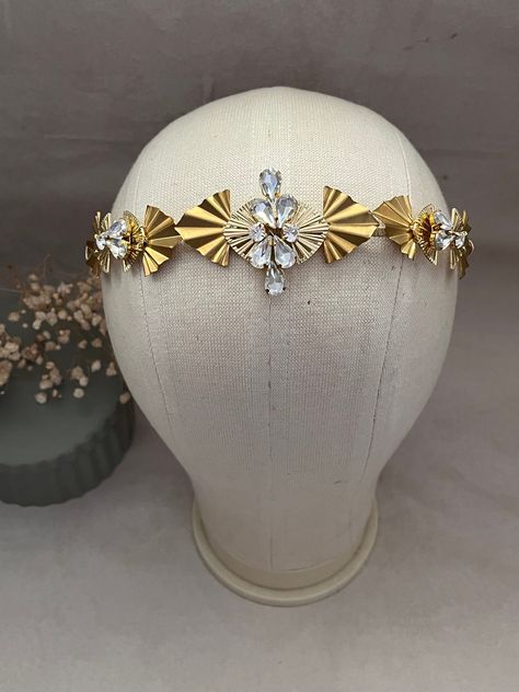 Elegant Art Deco inspired hair accessory, Gold Bridal Tiara, Halo Crown Headpiece. Brand New from our AW Art Deco Inspired Collection. This headpiece is so wonderfully elegant, it was designed with the Art Deco era in mind. Gold Deco replica pieces in two shades of gold are the main focal point to this collection, intricately handwoven crystals to add a little bit of sparkle to this glamorous collection. These pieces will work perfectly with an Art Deco inspired wedding or a 1920s event. Light w Elegant Headpiece, Art Deco Tiara, Adjustable Art Deco Headpiece For Party, Art Deco Hair Piece, Gold Gatsby Headpiece For Vintage Events, Adjustable Art Deco Wedding Headpieces, 1920s Hair Accessories, Bridal Art, 1920s Hair